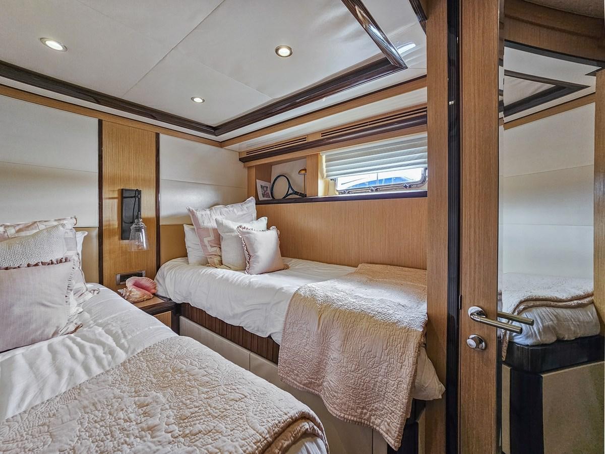 a couple of beds in a hotel room aboard O A Yacht for Sale