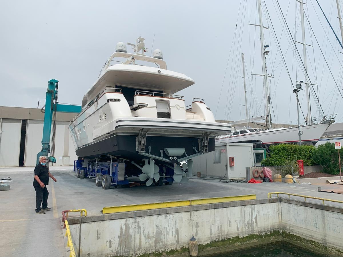a large white ship docked aboard ACCI Yacht for Sale