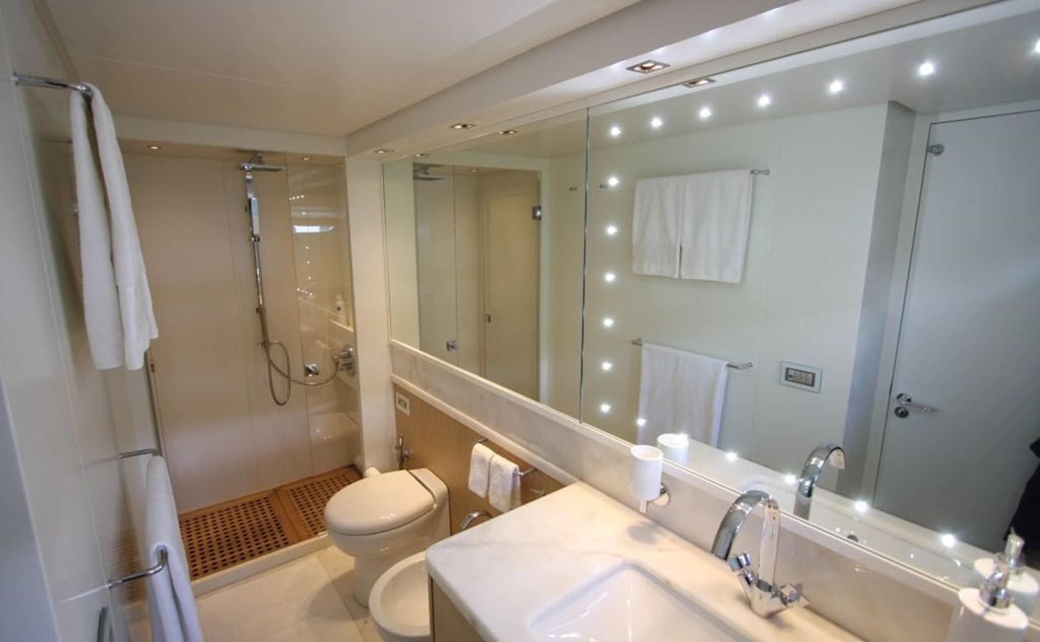 a bathroom with a large mirror aboard ACCI Yacht for Sale