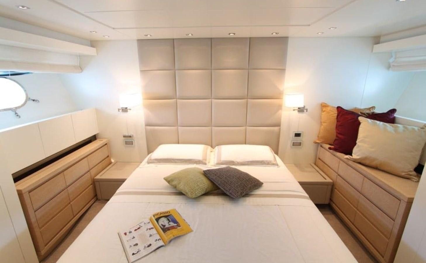 a room with a bed and a desk aboard ACCI Yacht for Sale