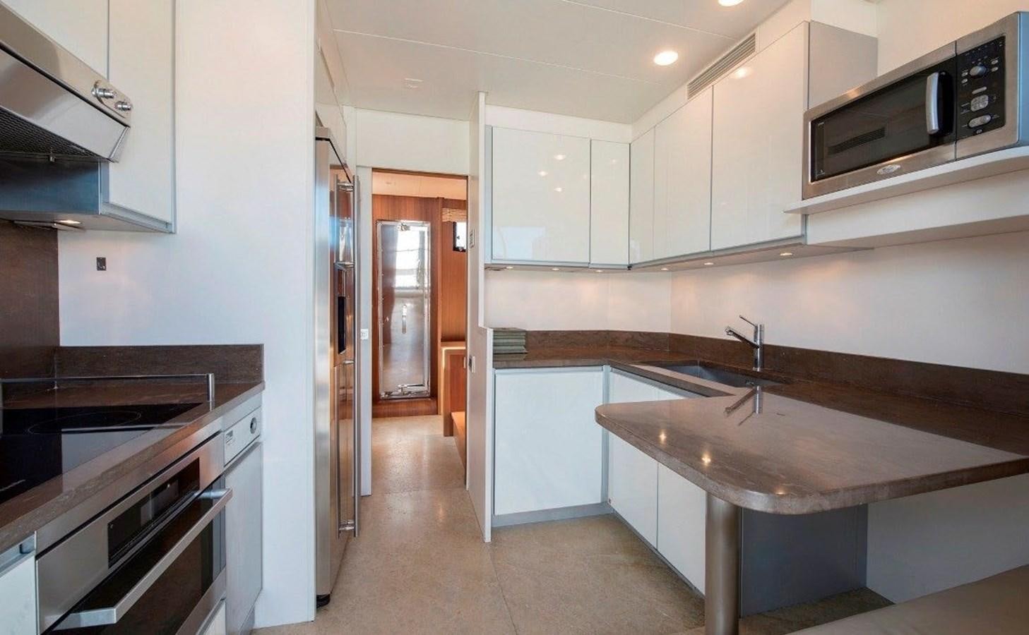a kitchen with a sink and stove aboard ACCI Yacht for Sale