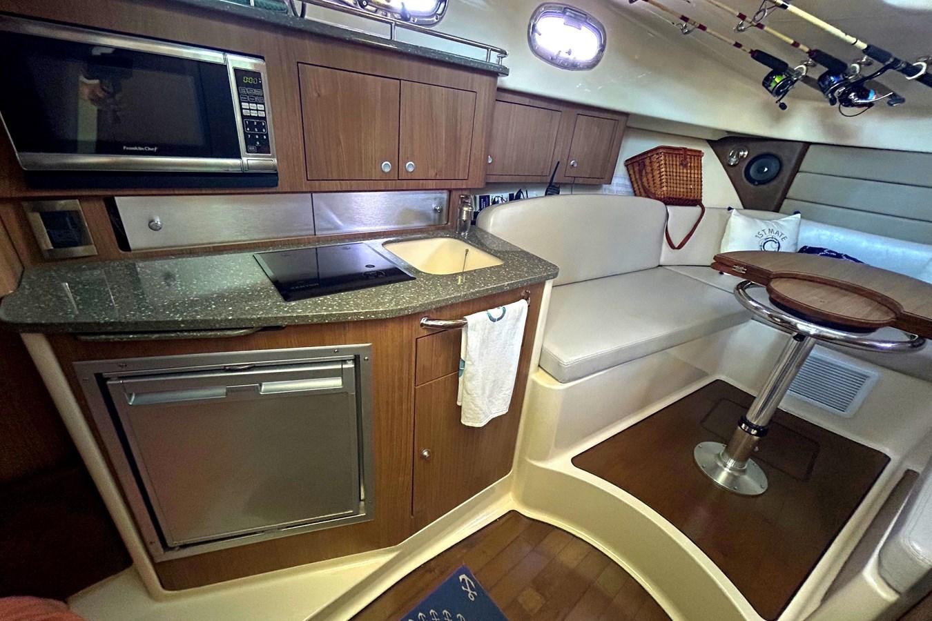 a kitchen with a microwave oven and a microwave aboard B Yacht for Sale