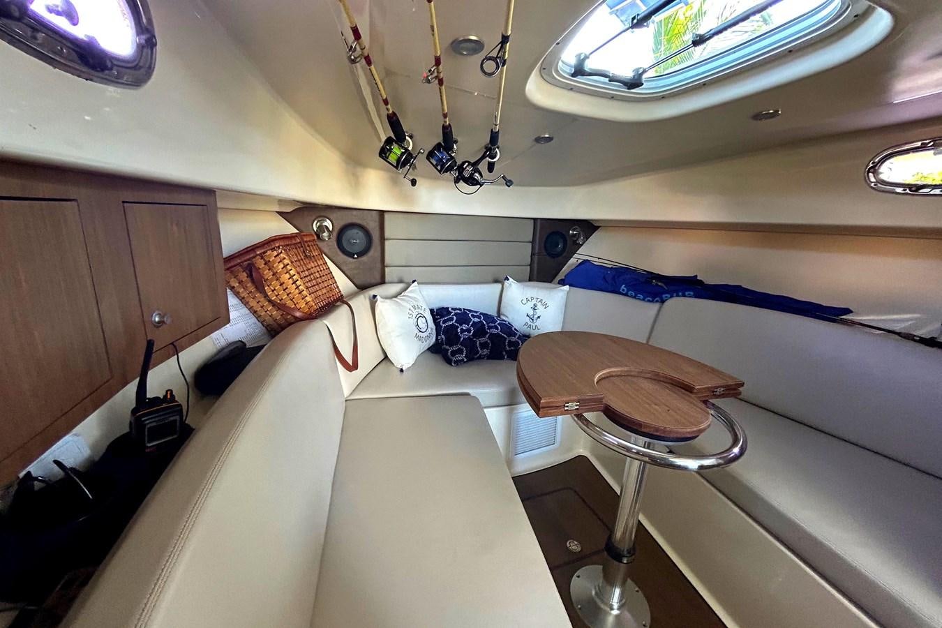 a room with a bed and a stool aboard B Yacht for Sale