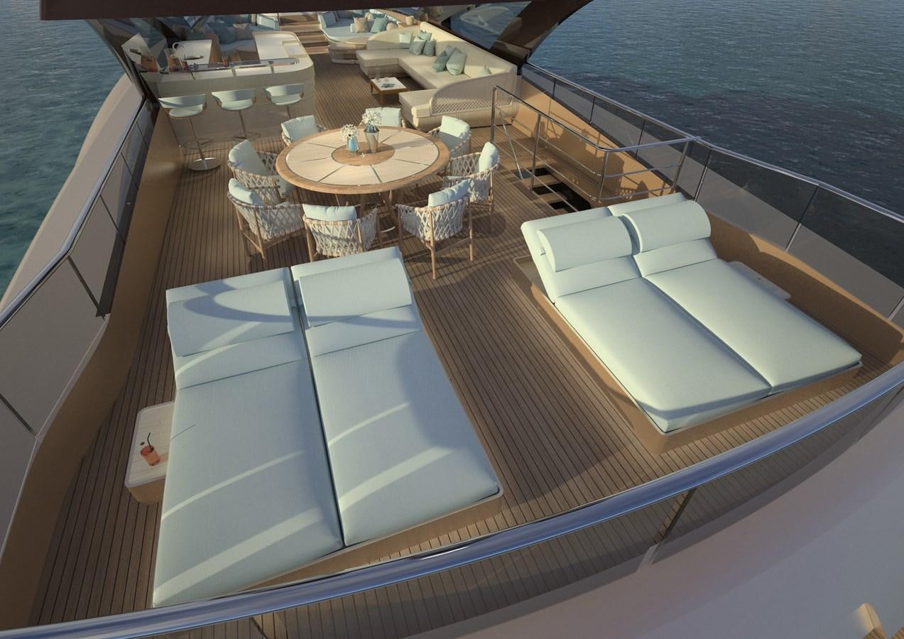 a deck with a table and chairs on it aboard ANJELIF Yacht for Sale