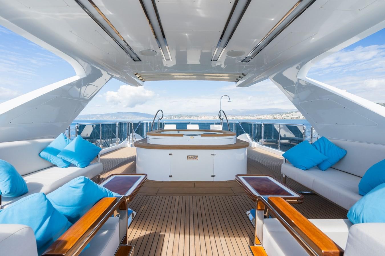 a boat with a wooden deck aboard MY PARADIS Yacht for Sale