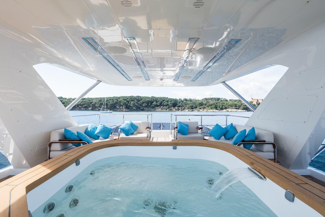 a pool with chairs and a table aboard MY PARADIS Yacht for Sale