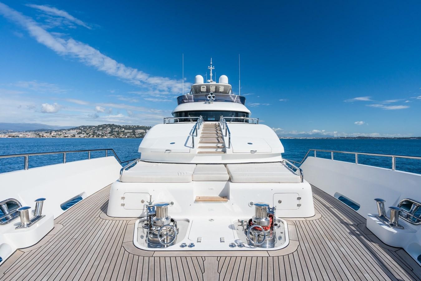 a large white ship on a deck aboard MY PARADIS Yacht for Sale