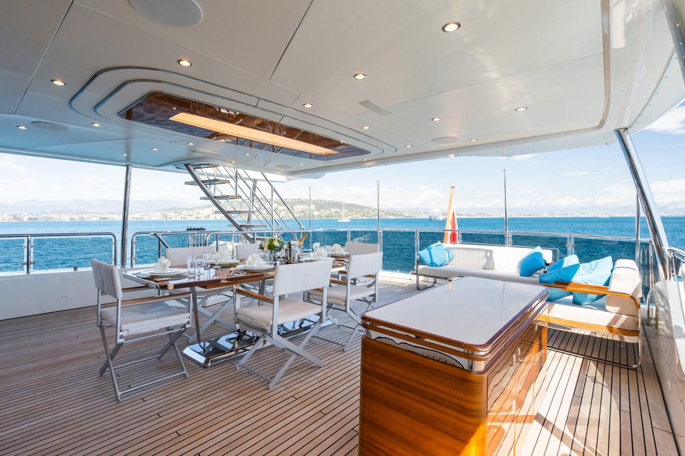 a room with a table and chairs aboard MY PARADIS Yacht for Sale