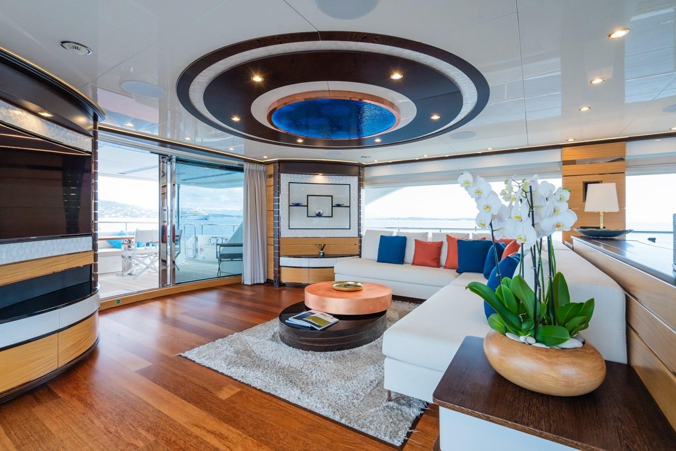 a modern living room with a large glass ceiling aboard MY PARADIS Yacht for Sale