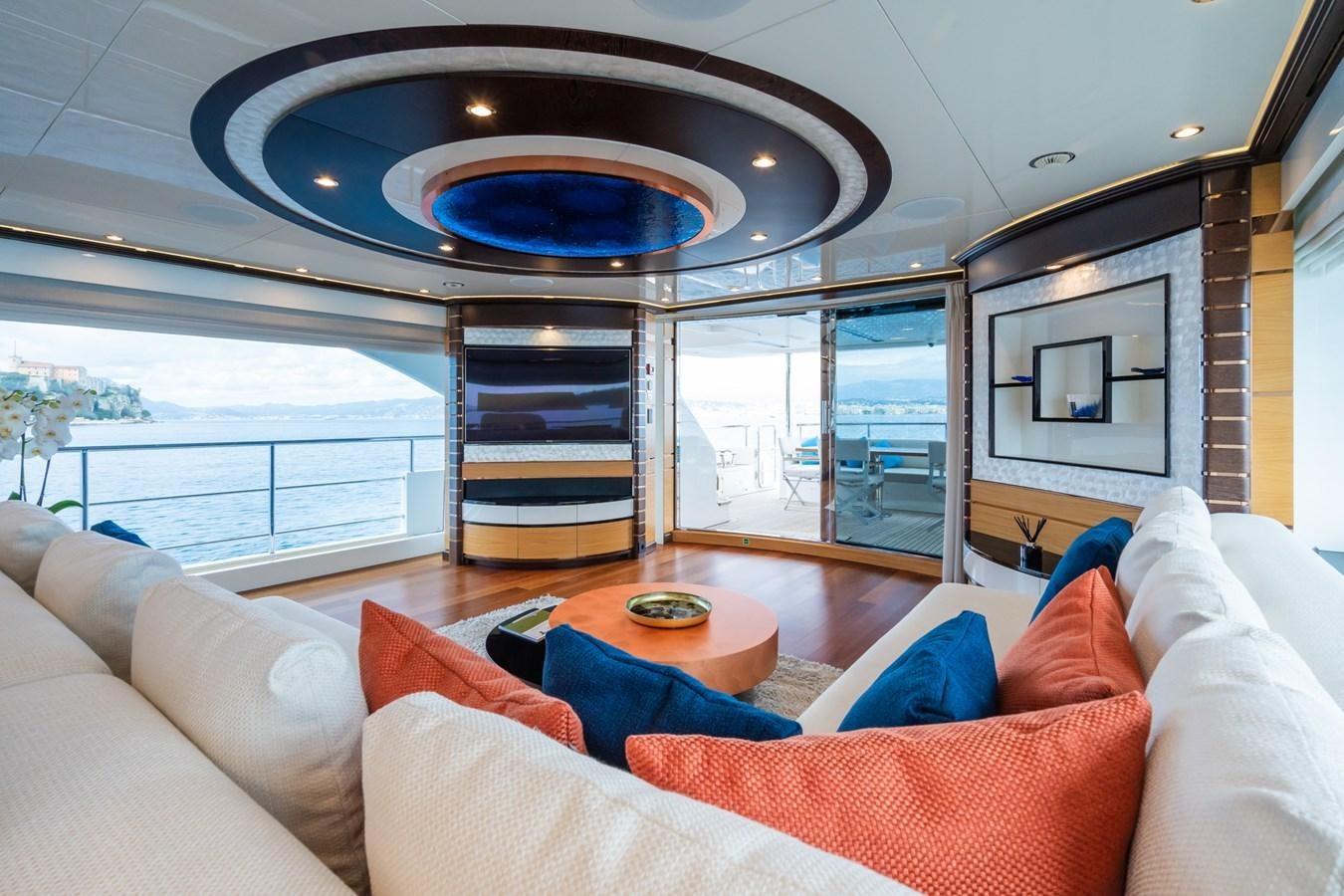 a living room with a large glass window aboard MY PARADIS Yacht for Sale