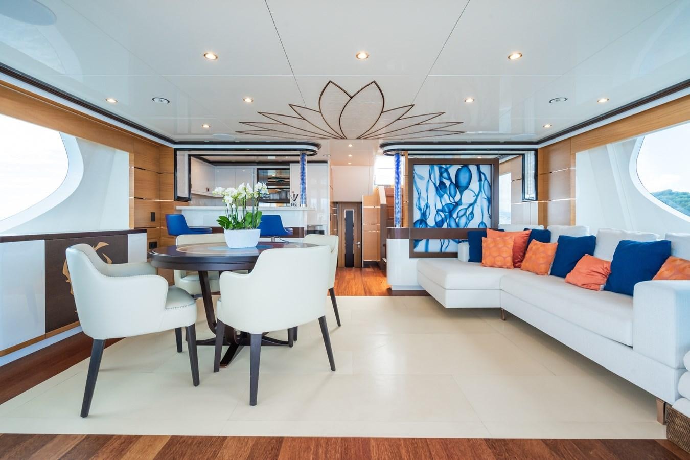 a living room with a white couch and a white sofa aboard MY PARADIS Yacht for Sale