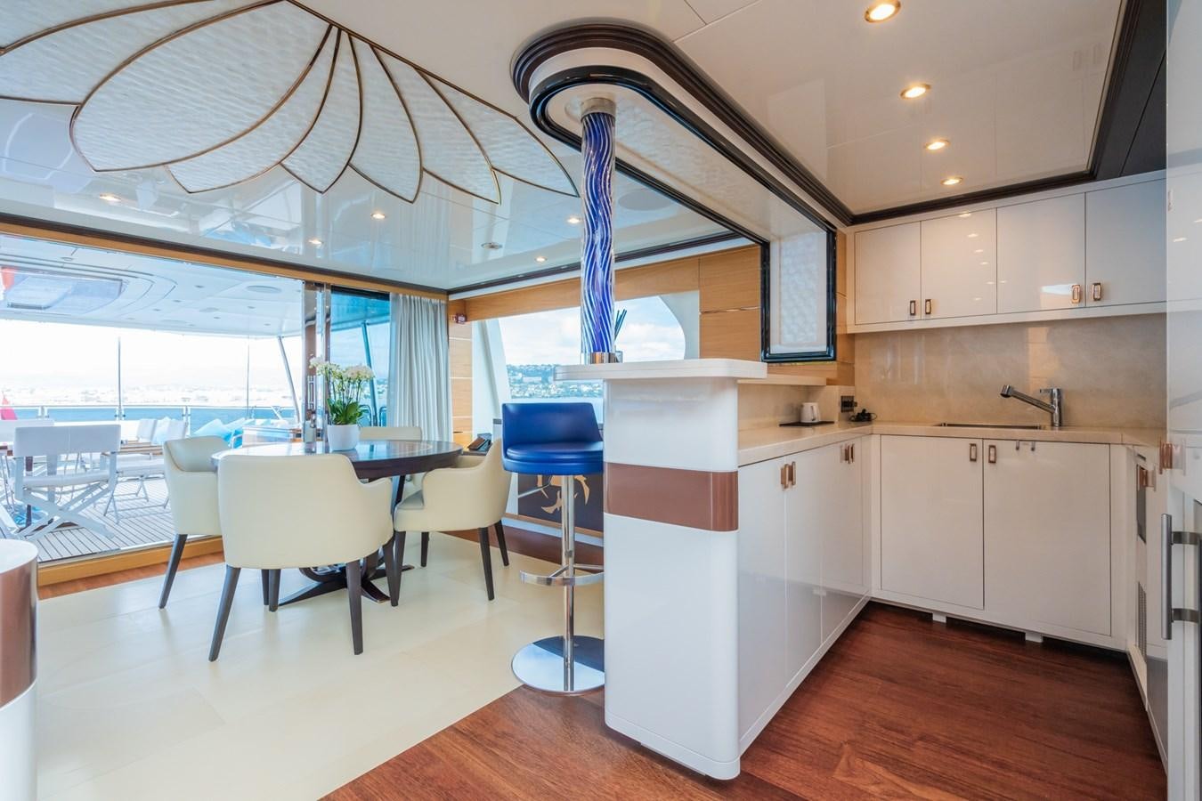 a kitchen with a large island aboard MY PARADIS Yacht for Sale