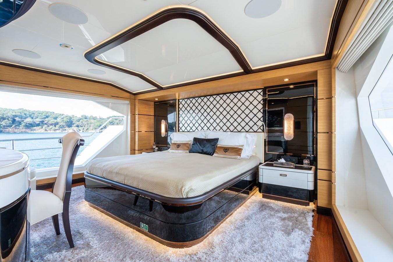 a bedroom with a large mirror aboard MY PARADIS Yacht for Sale