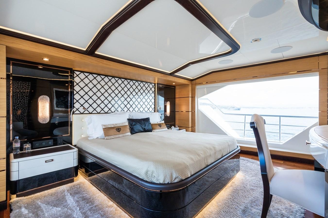 a bedroom with a large bed aboard MY PARADIS Yacht for Sale