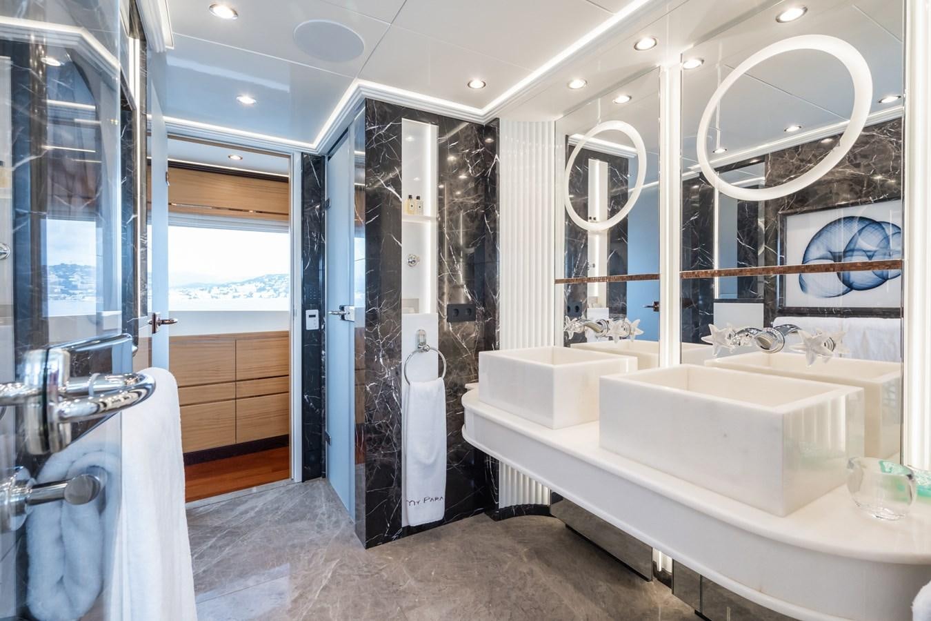 a bathroom with a tub sink and shower aboard MY PARADIS Yacht for Sale