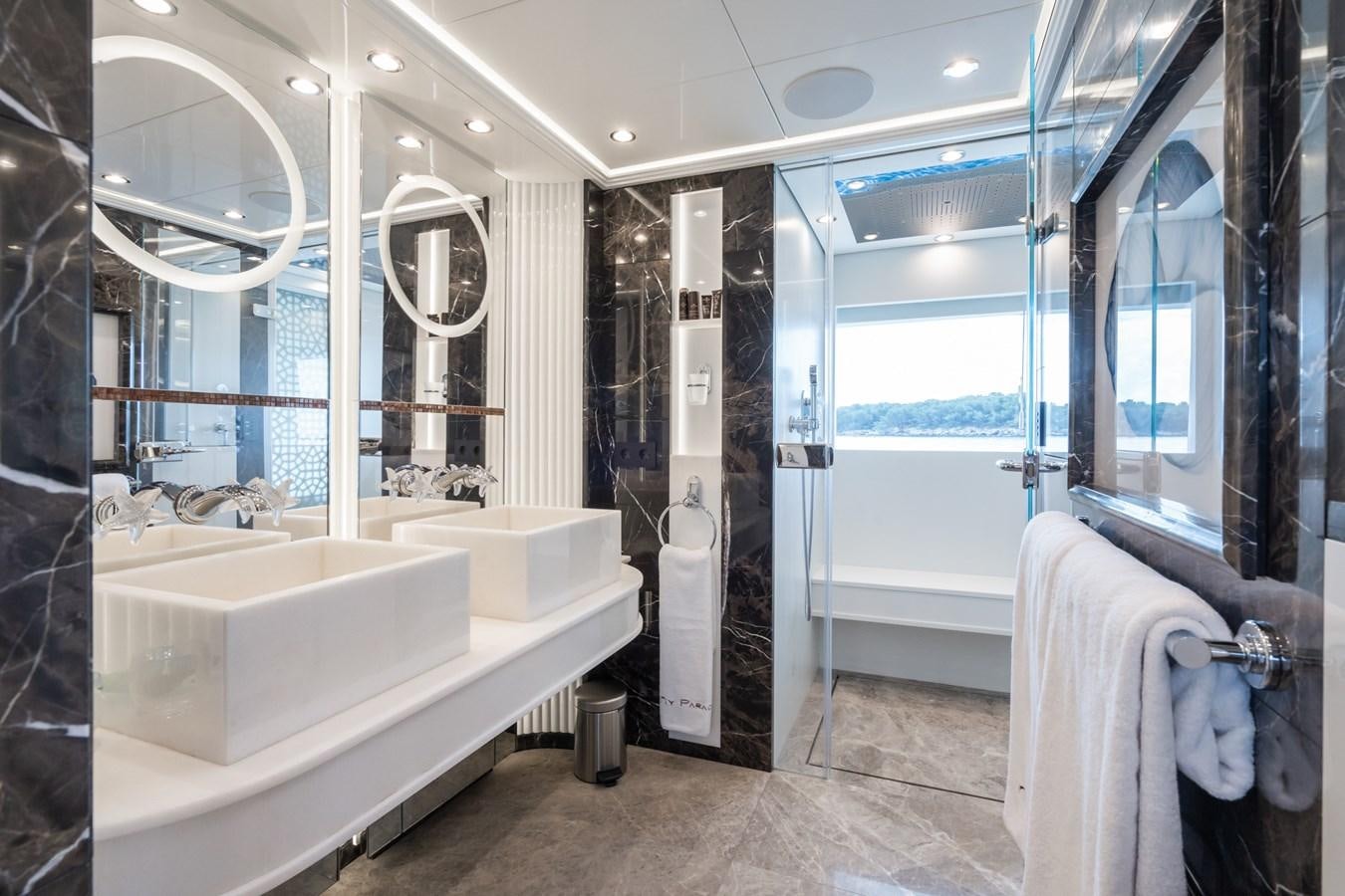 a bathroom with a tub and a sink aboard MY PARADIS Yacht for Sale