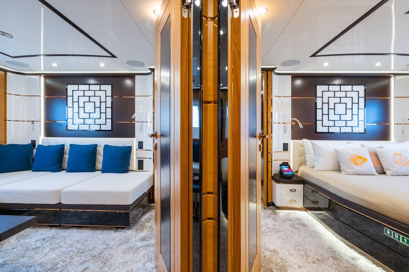 a room with a bed and a couch aboard MY PARADIS Yacht for Sale