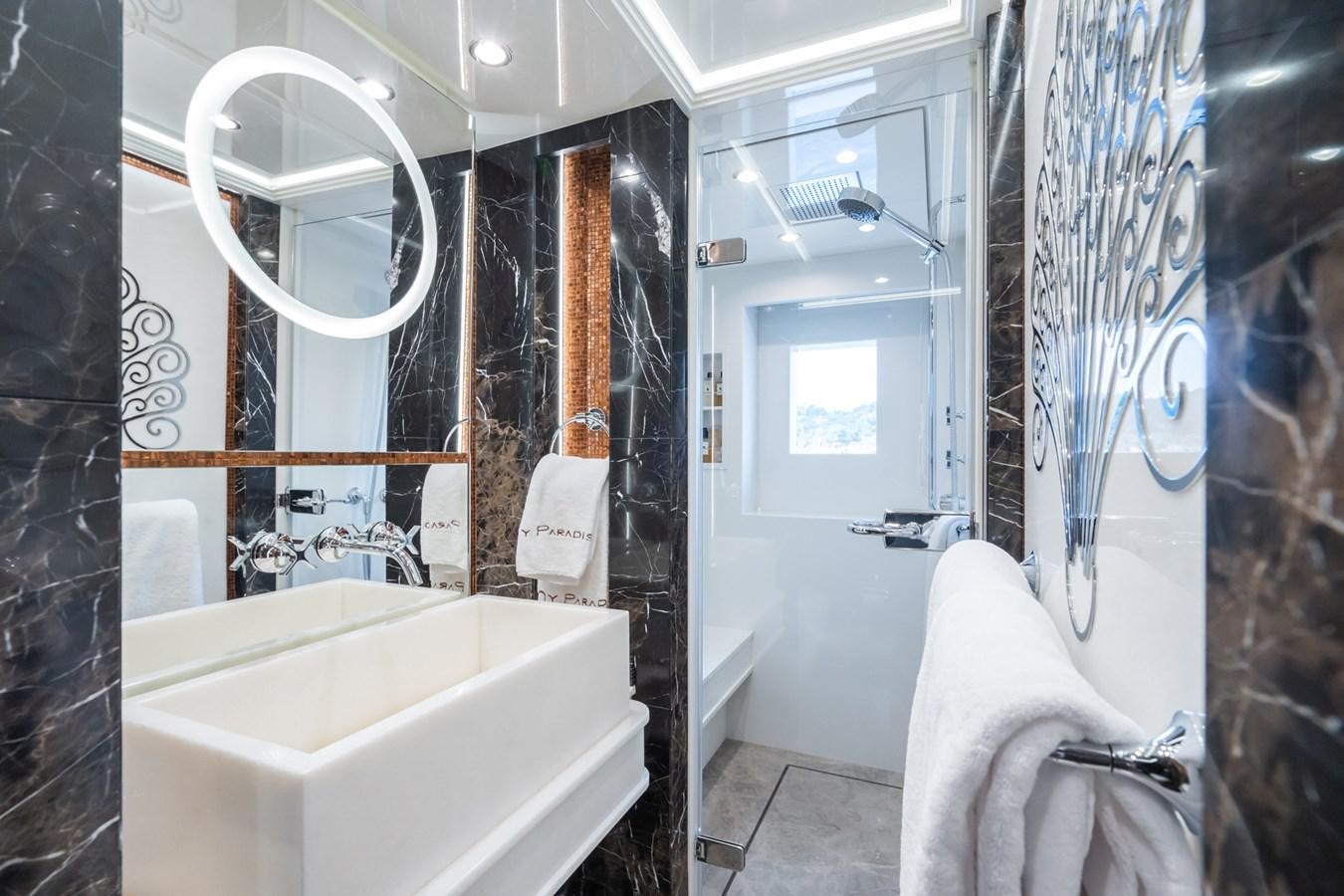 a bathroom with a bathtub and sink aboard MY PARADIS Yacht for Sale