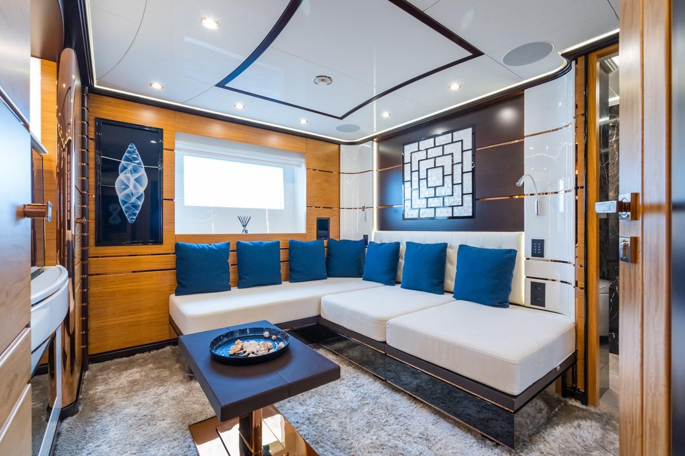 a room with a couch and a table aboard MY PARADIS Yacht for Sale