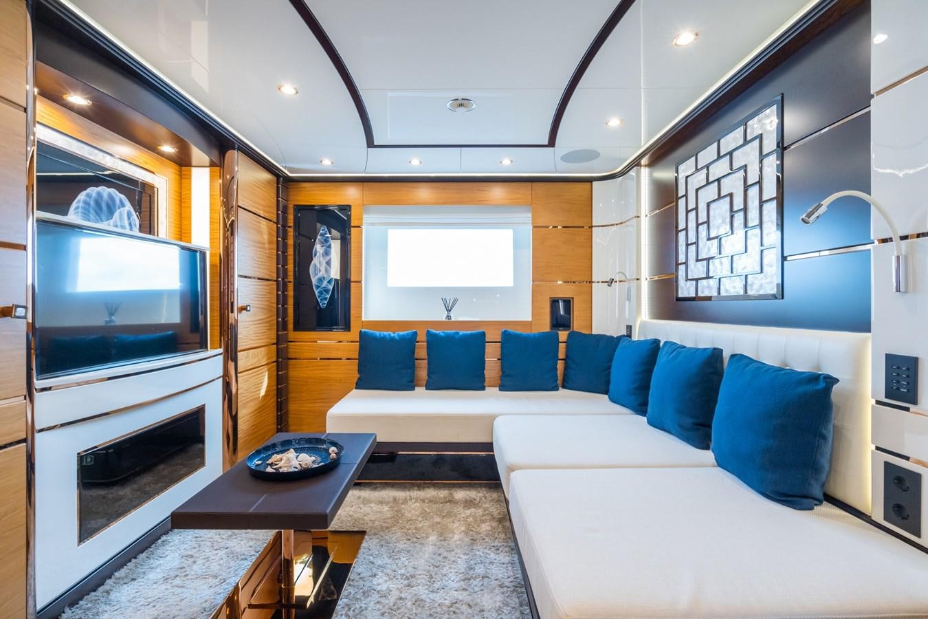 a living room with a couch and a tv aboard MY PARADIS Yacht for Sale