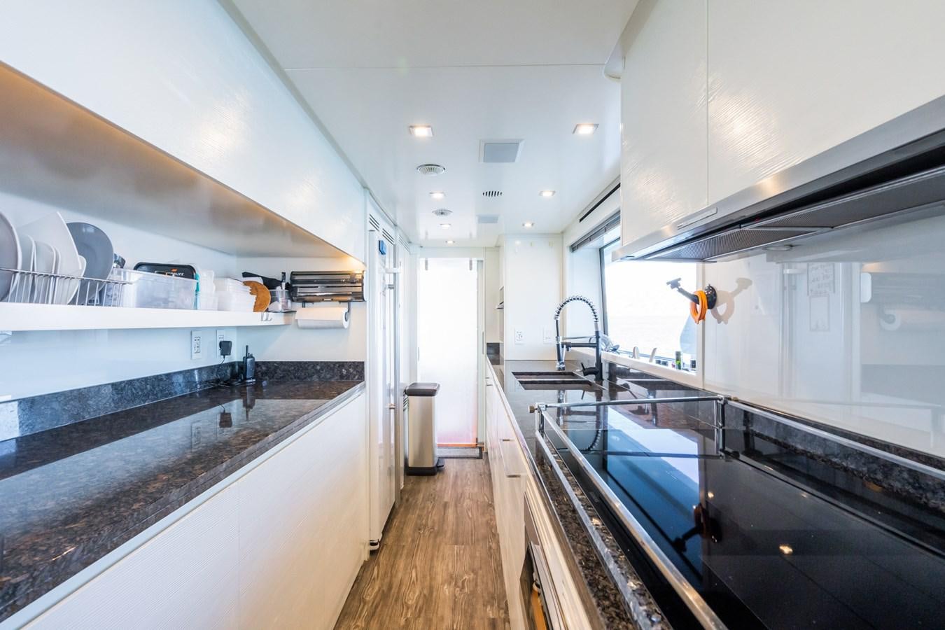 a kitchen with a large countertop aboard MY PARADIS Yacht for Sale