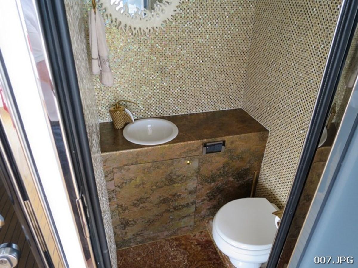 a bathroom with a sink and toilet aboard VICTORIOUS Yacht for Sale