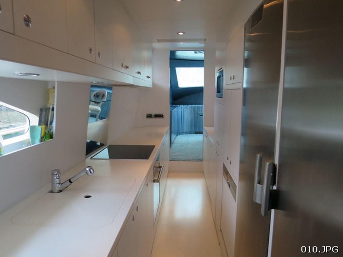 a kitchen with a sink and cabinets aboard VICTORIOUS Yacht for Sale