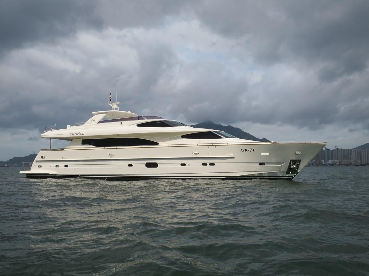 a white yacht in the water aboard VICTORIOUS Yacht for Sale