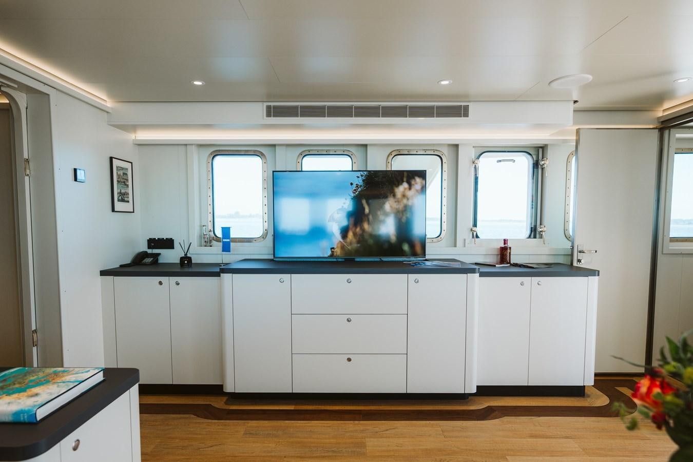 a room with a large fish tank aboard SCINTILLA MARIS Yacht for Sale