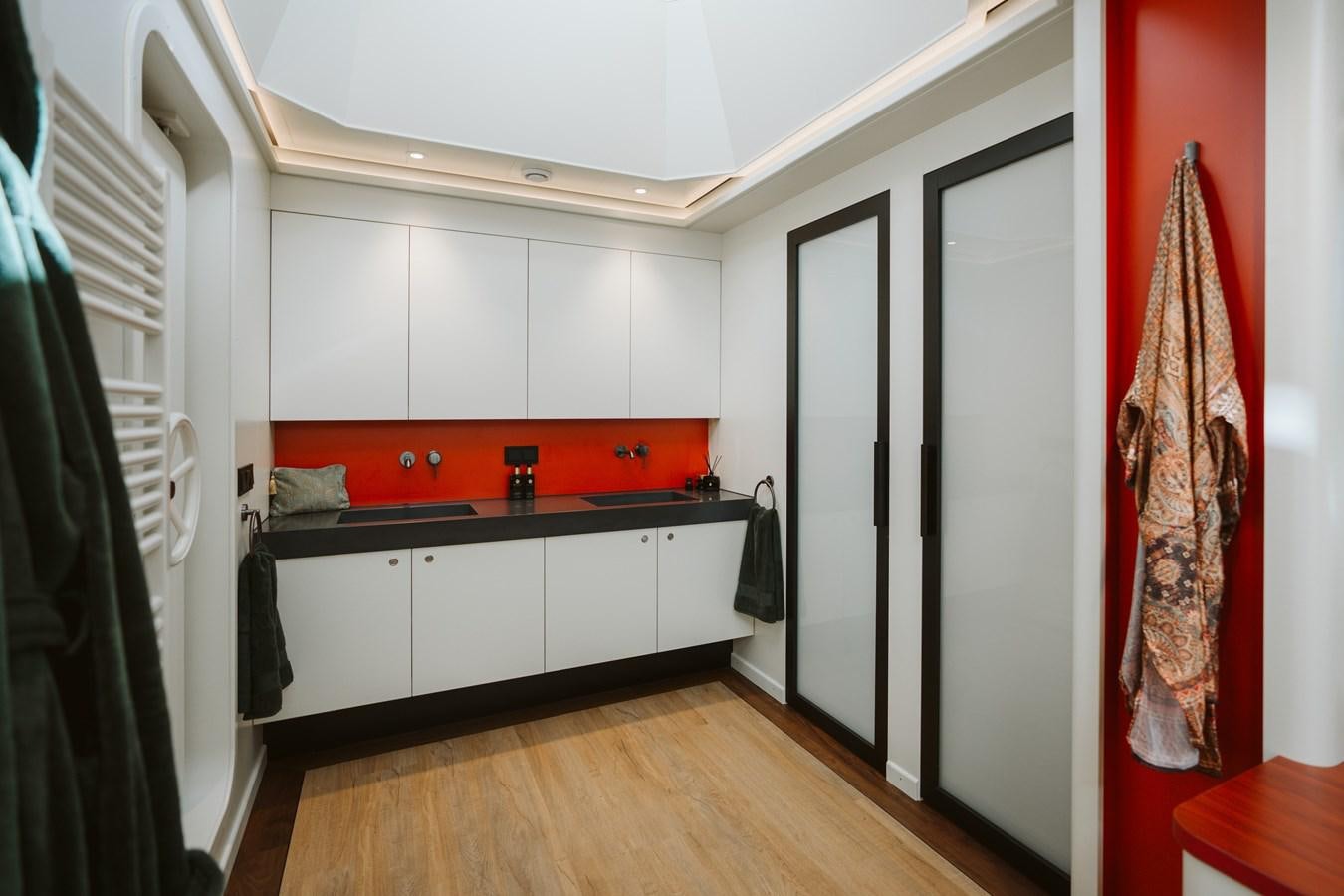 a kitchen with white cabinets aboard SCINTILLA MARIS Yacht for Sale