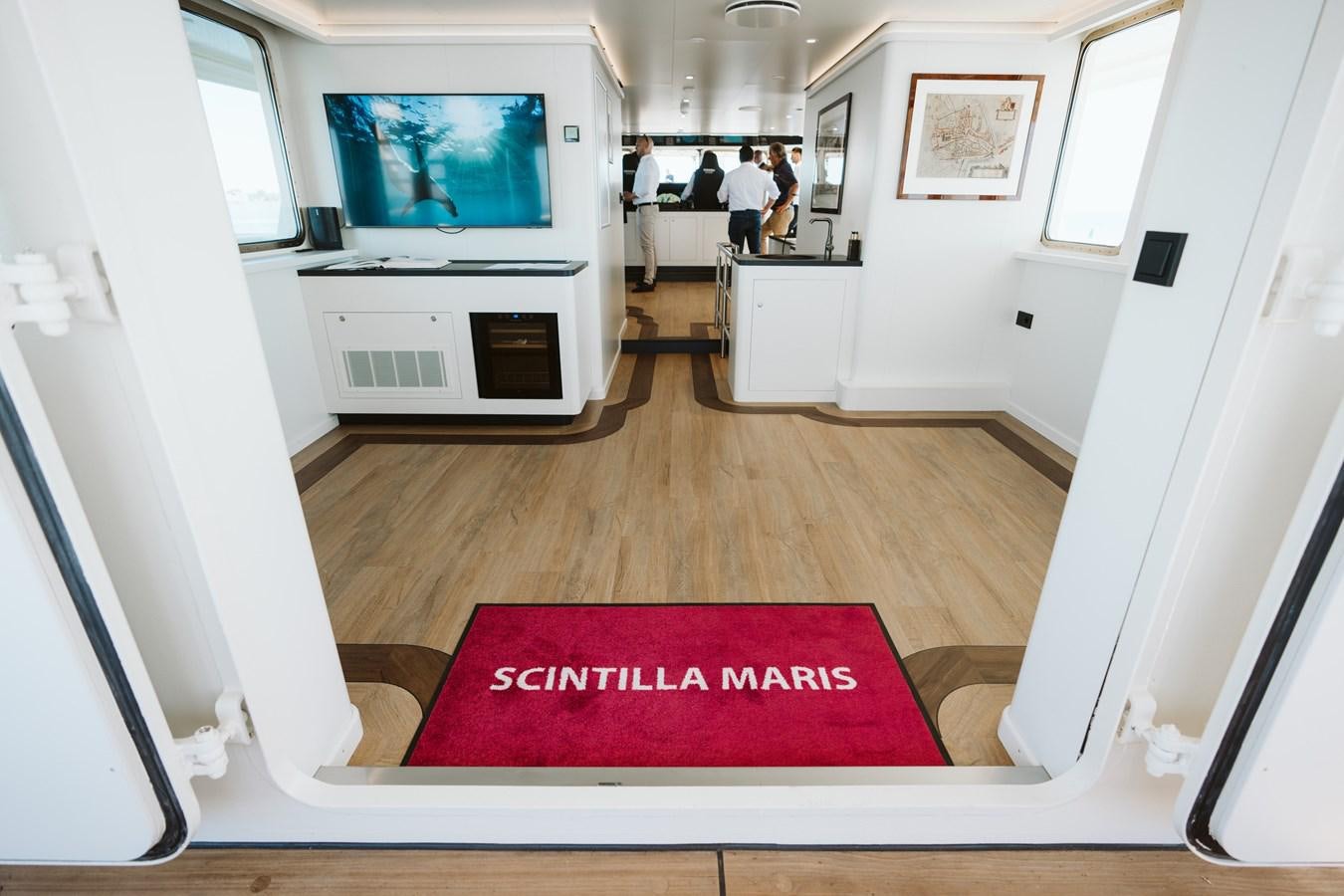 a room with a red rug aboard SCINTILLA MARIS Yacht for Sale