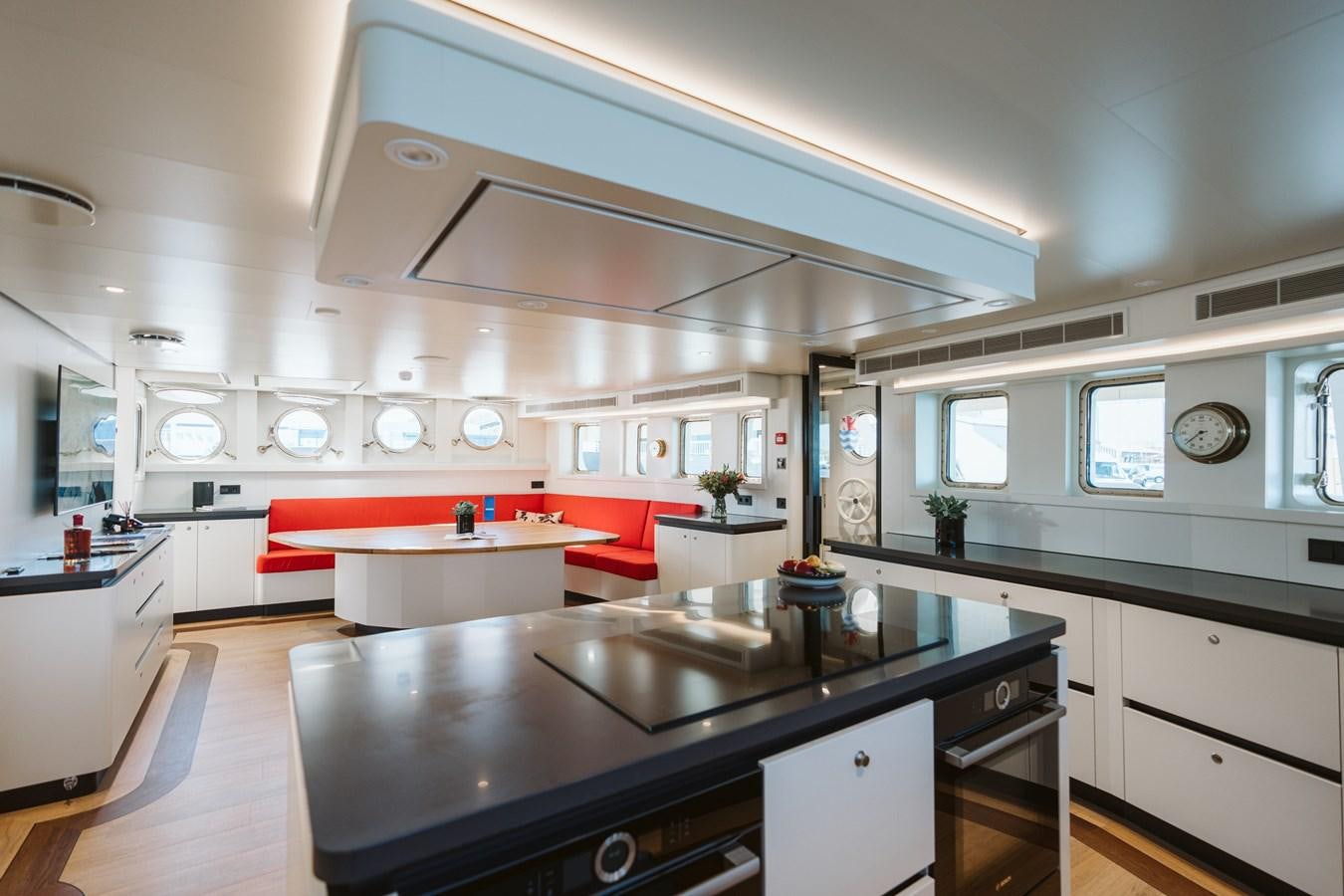 a kitchen with a large island aboard SCINTILLA MARIS Yacht for Sale