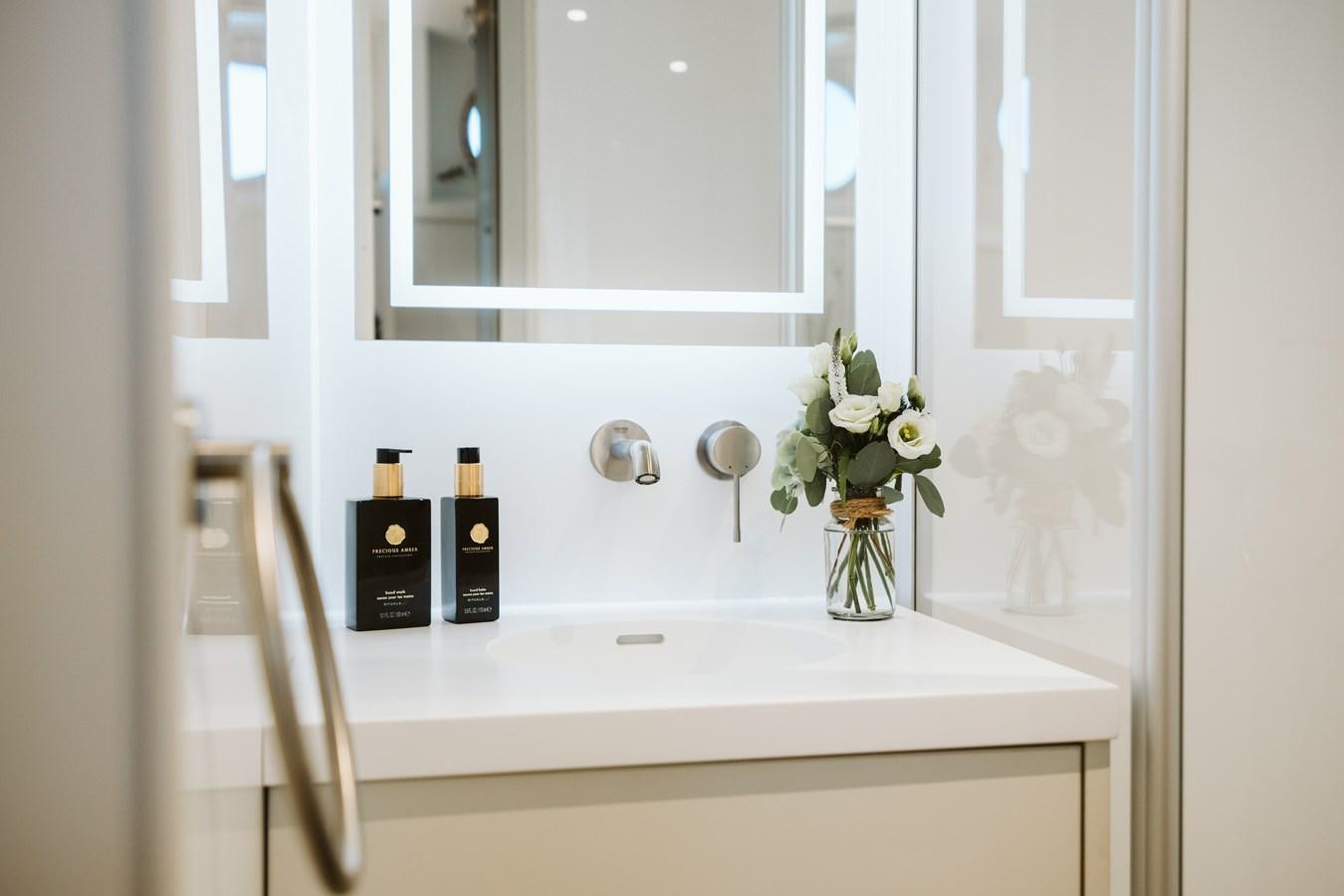 a bathroom sink with a mirror aboard SCINTILLA MARIS Yacht for Sale