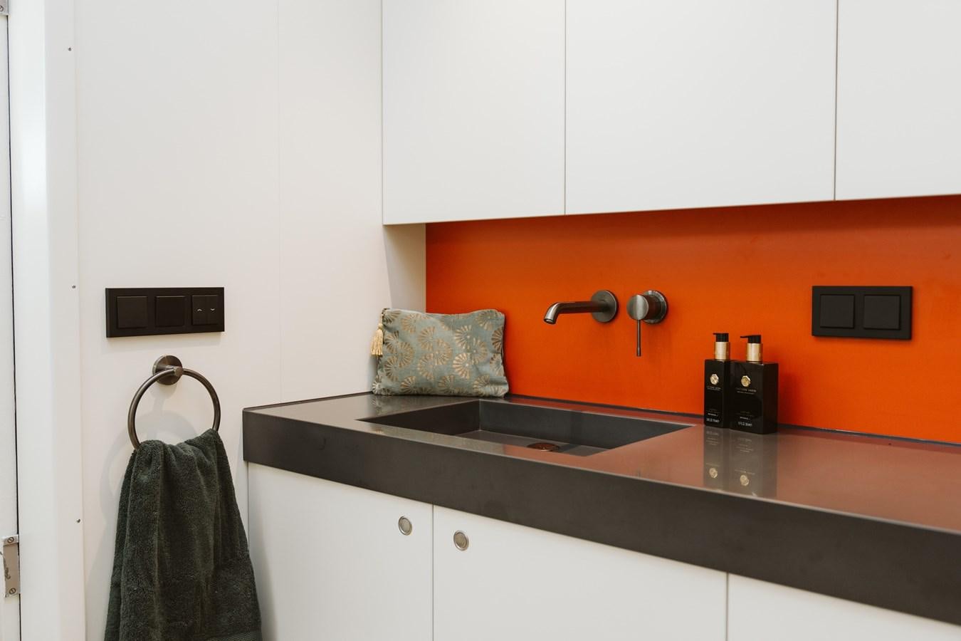 a kitchen with a black counter top aboard SCINTILLA MARIS Yacht for Sale