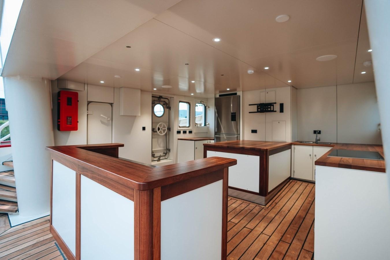 a kitchen with a counter and cabinets aboard SCINTILLA MARIS Yacht for Sale