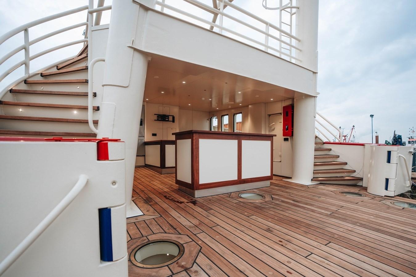 a wooden building with a white roof aboard SCINTILLA MARIS Yacht for Sale