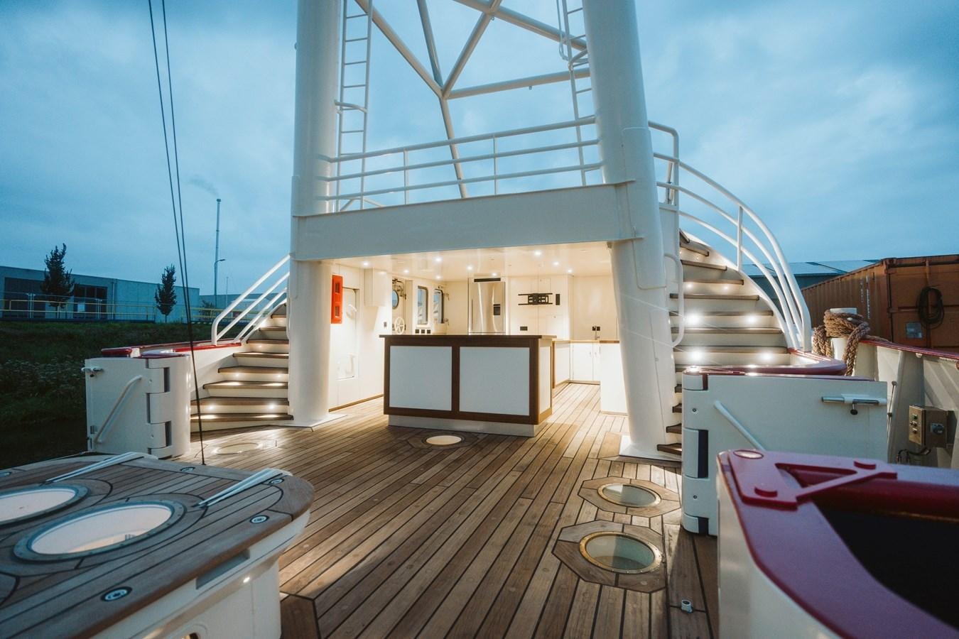 a large white building with a balcony aboard SCINTILLA MARIS Yacht for Sale