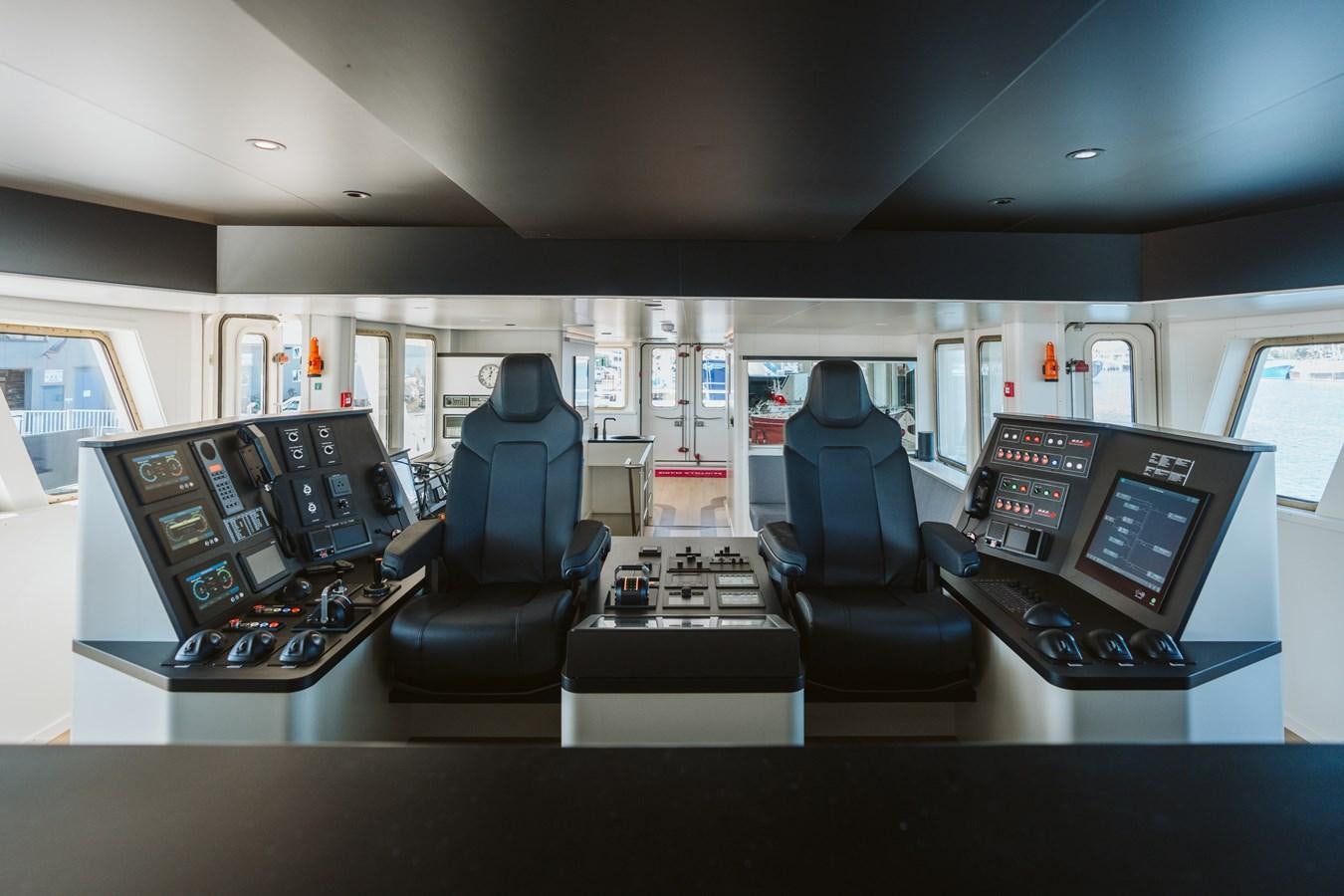 a room with a few computers and chairs aboard SCINTILLA MARIS Yacht for Sale