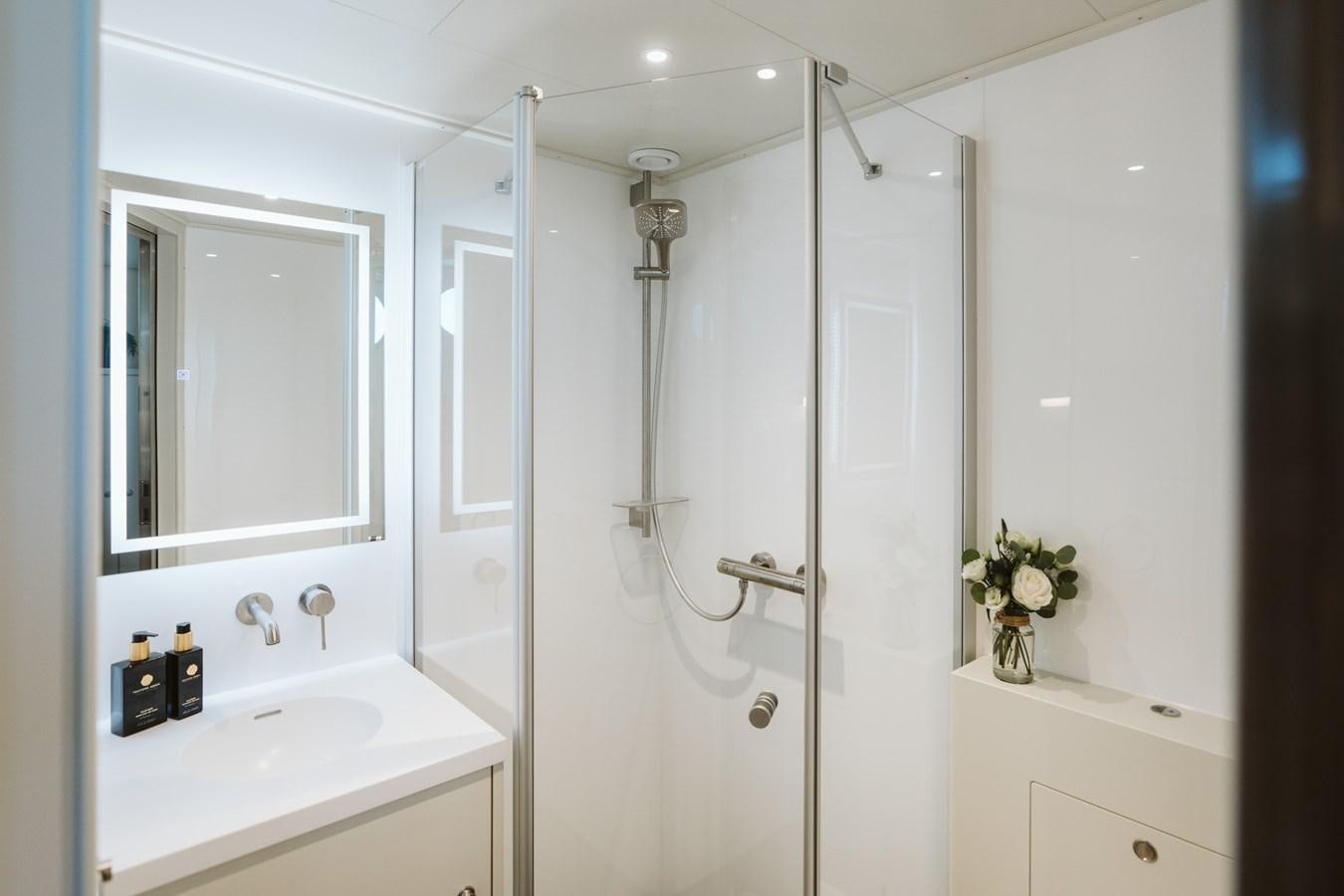 a bathroom with a shower unit and sink aboard SCINTILLA MARIS Yacht for Sale