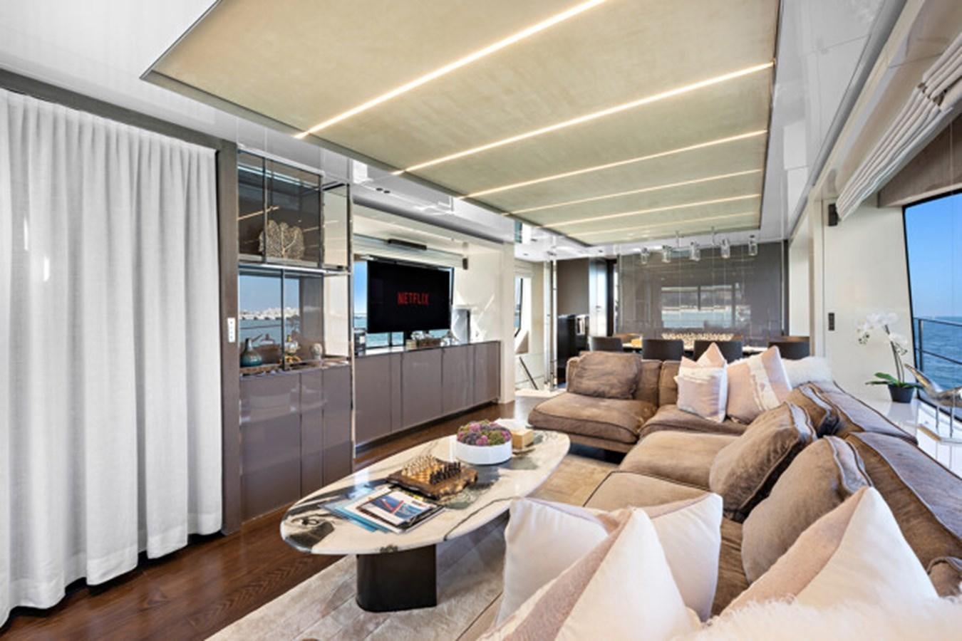 a living room with a couch and a tv aboard MOSHE Yacht for Sale