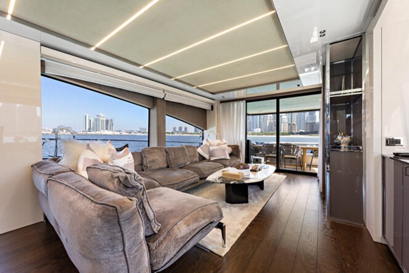 a living room with a large window aboard MOSHE Yacht for Sale