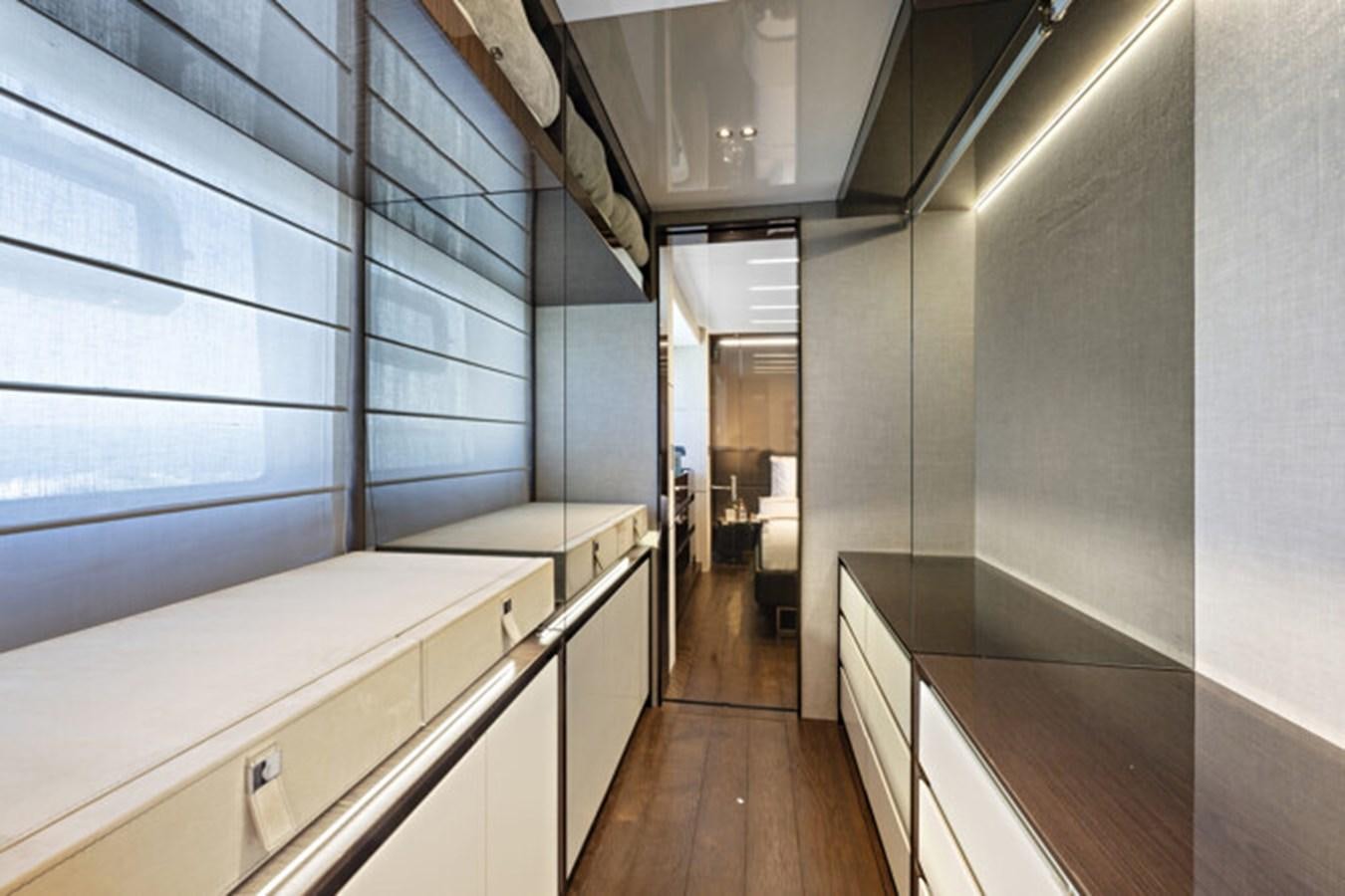 a kitchen with white cabinets aboard MOSHE Yacht for Sale