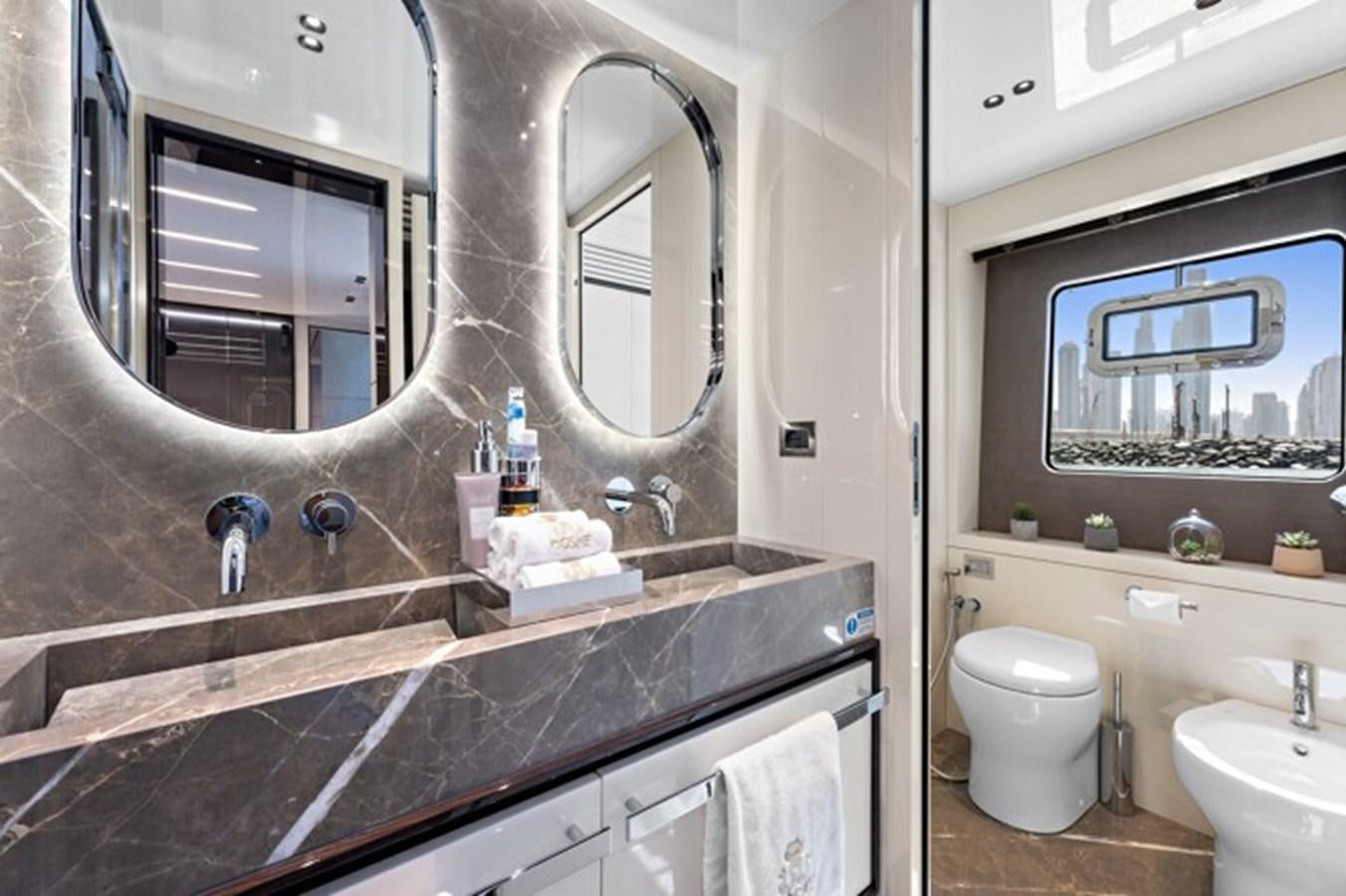 a bathroom with a large mirror aboard MOSHE Yacht for Sale