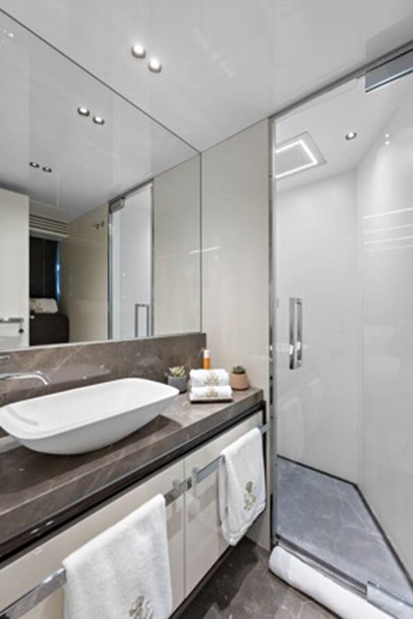 a bathroom with a sink and a mirror aboard MOSHE Yacht for Sale