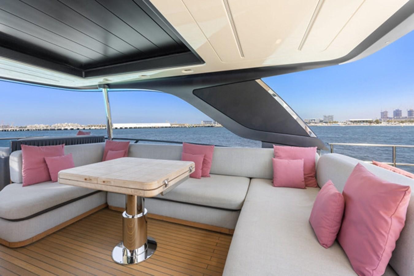 a couch and a table on a boat aboard MOSHE Yacht for Sale