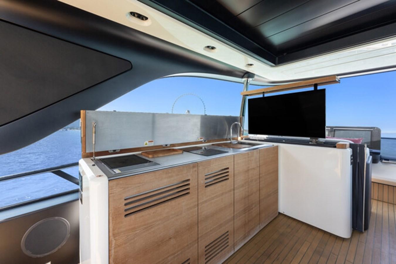 a kitchen with a large window aboard MOSHE Yacht for Sale