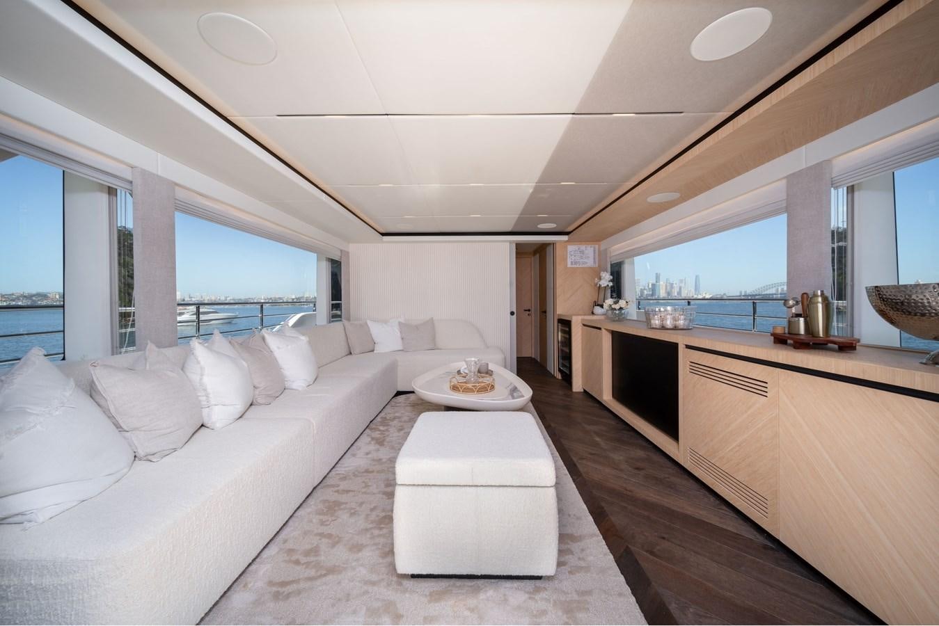 a large white bed in a room aboard #5 NOMAD 101 Yacht for Sale