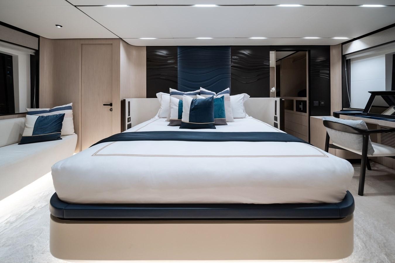 a large bed in a room aboard #5 NOMAD 101 Yacht for Sale
