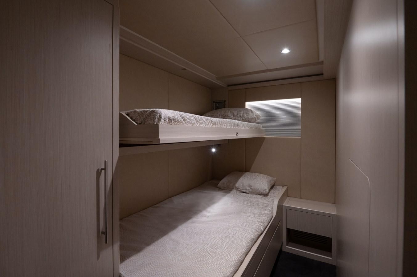 a room with two beds aboard #5 NOMAD 101 Yacht for Sale