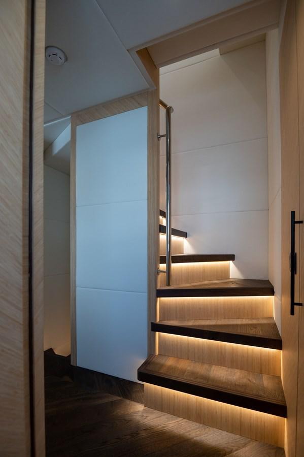 a staircase with a glass door aboard #5 NOMAD 101 Yacht for Sale